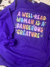 Load image into Gallery viewer, A well read woman is a dangerous creature graphic tee/sweatshirt