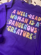 Load image into Gallery viewer, A well read woman is a dangerous creature graphic tee/sweatshirt